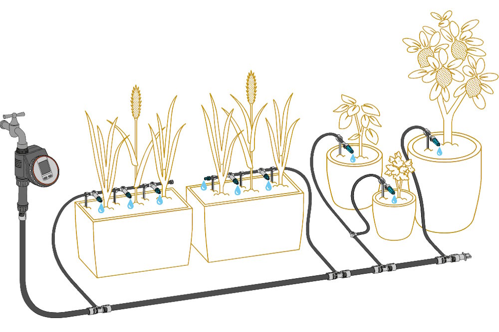 Ein automatisches Tropfbewässerungssystem mit Zeitschaltuhr versorgt verschiedene Pflanzen mit Wasser.